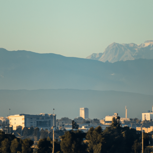 A panoramic view of Adana city with the majestic Taurus Mountains in the background